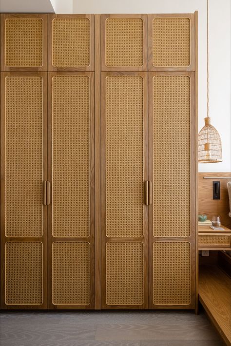 Our storage cabinet keeps things neatly organized with its adjustable shelves in the interior, and drawers and open shelves with adjustable heights. This cabinet is designed to be a sustainable piece of furniture with its solid wood handles, FSC certified solid wood trims, and bamboo and rattan finish. Wardrobe Design Bedroom Boho, Boho Wardrobe Closet, Bamboo Wardrobe Doors, Rattan Finish Wardrobe, Bohemian Wardrobe Design, Wooden Finish Wardrobe, Rattan Door Cabinets, Modern Wardrobe Design Ideas, Rattan Wardrobe Design