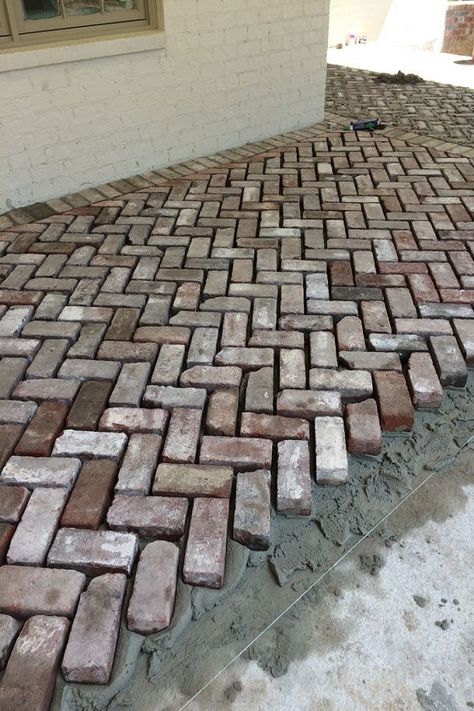 This walkway design made with red bricks is an easy approach to prevent the walkway from dirt and rain. An easy and simple idea to bring newness in the house. Place the bricks in a way you like on the ground and increase the worth of your outdoor space. Brick Driveway, Brick Paver Patio, Brick Pathway, Walkway Landscaping, Walkway Design, Brick Walkway, Reclaimed Brick, Garden Paving, Garden Walkway