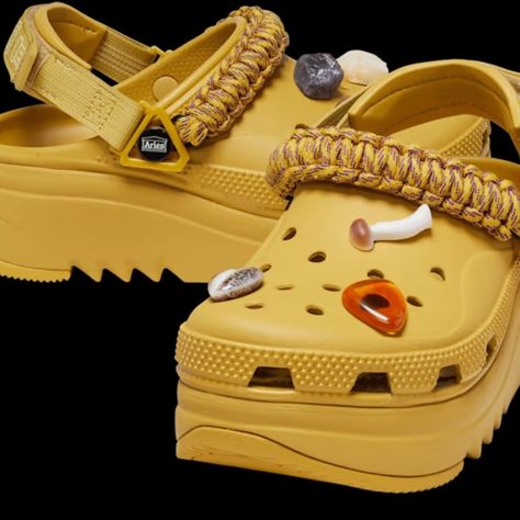 Embrace The Fusion Of Fashion And Function With This Exclusive Style From Aries X Crocs. The Signature Hiker Clog Gets An Elevated Update With A Paracord Feature And Polished Stone And Geode Jibbitz Charms. Made With The Comfy Croslite Foam Upper Of Our Classic Clog, A Daring Midsole With Some Added Height, And A Sawtooth Outsole For Superior Traction, Allowing You To Leave Your Mark Wherever You Go Aries Logo On Strap Polished Stone And Geode Jibbitz Charms Classic Clog Upper And Fit Two-Piece Crocs Bae Clogs With Jibbitz, Crocs Shoes Women Crocs Shoes, Women's Crocs Crocs Shoes, Clogs Crocs Shoes, Classic Cozy Sandal Crocs, Bone Croc Sandals, Classic Hiker Clog Crocs, Best Croc Accessories, Crocks Sandals For Women