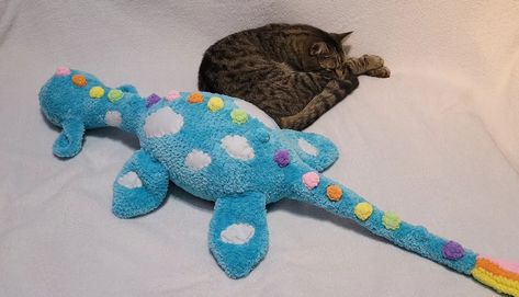 Size check! 📏 My cat has officially met Nessie the Sea Monster—and Nessie definitely wins in the size department! 😲🐾 I knew this plushie was going to be big, but seeing it next to my little bubba really puts it into perspective 😅 Nessie is a giant in comparison! Who else loves oversized plushies? 🙋‍♀️ Pattern by @moontyasha #nessievscat #giantplushie #handmadewithlove #craftingjoy #plushiegoals #crochetmagic #homedecor #lochnessmonster #seaserpent #rainbownessie #skyisthelimit #amigurum... Plushies Pattern, Sea Serpent, Sea Monster, Loch Ness Monster, Sea Monsters, My Cat, The Sea, Crochet, Pattern