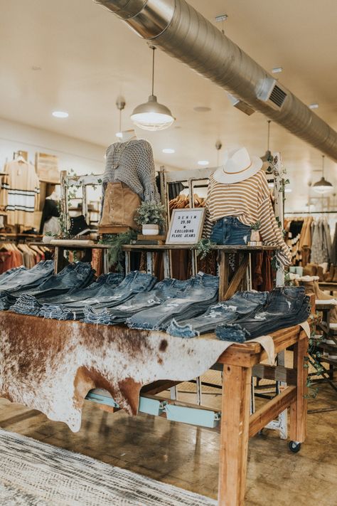 Wooden Spool Retail Display, Boutique Jeans Display, Retail Jean Display, Clothing Displays Ideas, Display Jeans Ideas, Western Storefront Ideas, Boutique Denim Display, Boot Store Display, How To Display Jeans In A Boutique