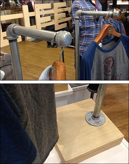 Iron Pipe as DIY Apparel Retail Display Pvc Tshirt Display Diy, Diy Pvc Shirt Display, Diy Shirt Display Stand, Tshirt Display Ideas Diy, Tshirt Stand Display Diy, What Disply To Use For Rolled Up Tshirt In A Gift Shop, Pvc Pipe Shirt Holder, Pipe Shirt Display, Tshirt Display Ideas Retail