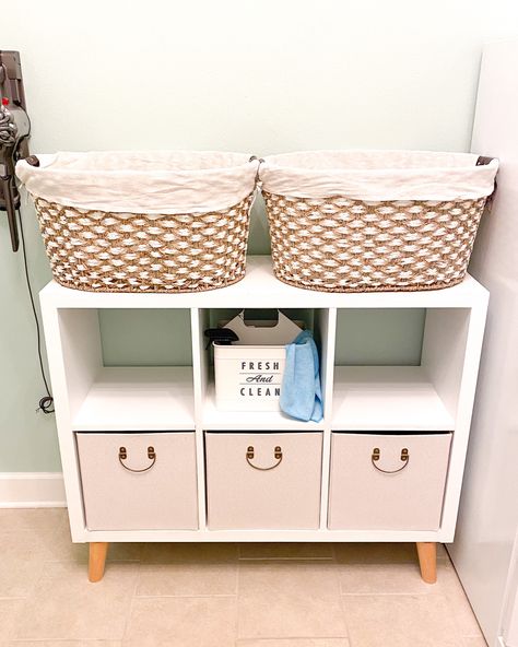 White storage cube, wooden feet, Seagrass laundry baskets, storage cubes, laundry decor Adding Feet To Cube Storage, Laundry Room Refresh, Diy Cube Storage, 6 Cube Organizer, Affordable Storage, Organizer Shelf, Storage Cube, Cube Organizer, Massage Room