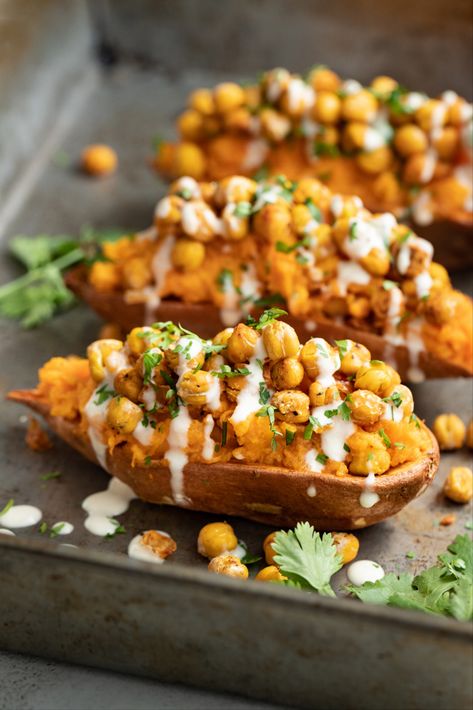 Chickpeas are so versatile! Our Chickpea Stuffed Sweet Potatoes feature crispy roasted chickpeas that add texture, protein & fibre to this delicious fall side dish. Make this recipe sweet or savoury with a quick switch of ingredients. Chickpea Stuffed Sweet Potato, Sweet Potato Chickpea Recipes, Crispy Roasted Chickpeas, Smashed Sweet Potatoes, Sweet Potato Side Dish, Sweet Potato Sides, Sweet Potato Hummus, Stuffed Sweet Potatoes, Autumn Side Dishes