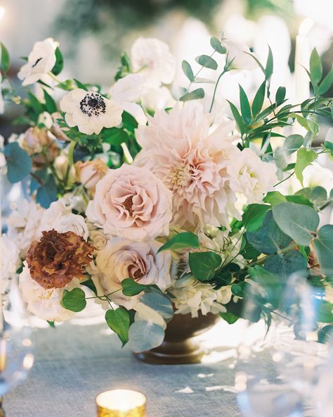 The centerpieces were comprised of a mix of different flowers, including anemones, roses, dahlias, and hydrangea. Their bronzed compotes added an extra dose of muted color and texture to each of the reception tables. Dahlia Centerpiece Wedding, Dahlia Centerpiece, Dahlia Wedding Bouquets, Orange Centerpieces, Unique Wedding Centerpieces, Pink Wedding Centerpieces, Nyc Florist, Dahlias Wedding, Tall Wedding Centerpieces