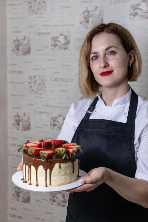 Portrait of a beautiful pastry chef woman holding a sponge cake royalty free stock photo Person Holding Food Reference, Baking Poses Reference, Person Holding Cake Reference, Holding Cake Reference Drawing, Holding Cake Drawing, Holding Birthday Cake Pose, Person Cooking Reference, Person Holding Cake, Holding Cake Reference