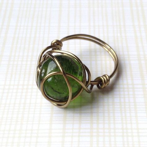 Forest Green Bead Wrapped in Antique Brass Wire Ring, size 7 by TheWireTorch on Etsy https://www.etsy.com/listing/243156913/forest-green-bead-wrapped-in-antique Wire Jewelry Patterns, Jewelry Knowledge, Asymmetrical Earrings, Green Rings, Wire Ring, Diy Wire Jewelry, Handmade Kids, Beaded Wraps, Wire Rings