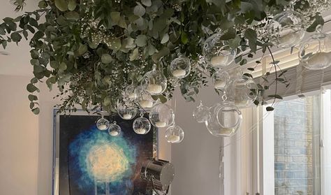 How to make a DIY branch chandelier for your Christmas decor | Livingetc Tree Branch Chandelier Wedding, Suspended Branches Christmas, Tree Branch Chandelier Rustic, Hanging Tea Lights Wedding Tree Branches, Christmas Ceiling, Gold Tree Branch Chandelier, Christmas Chandelier, Lighted Branches, Branch Chandelier