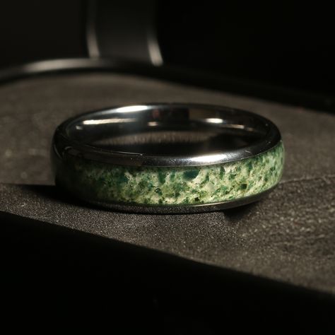 🌿💍 6mm Dome Polished Silver Moss Agate Men's Wedding Band 💍🌿 Stand out on your special day with our unique men's wedding band, featuring a stunning crushed moss agate inlay! 🌟 This 6mm dome polished silver ring is perfect for the modern man who wants to celebrate love with style and individuality. ✨ Why You'll Love It: Sleek 6mm width for a refined look Dome polished finish for a sophisticated appearance Crafted from durable tungsten carbide Unique inlay that captures the beauty of... Moss Agate Rings For Men, Jade Mens Wedding Band, Luxury Men's Agate Ring, Luxury Agate Men's Ring, Luxury Agate Gemstone Men's Ring, Mens Wedding Bands Unique, Polish Silver, Tungsten Carbide, Moss Agate