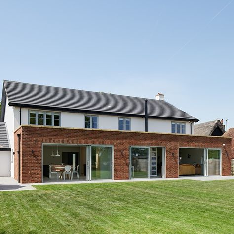 Dreaming of the Summer with this lovely project in Ware!⁠ ⁠ Our client wanted a contemporary style of door with a traditional look, so these wide aluminium sliding doors, finished in a soft grey on the outside and white on the inside, were the perfect option. ⁠ ⁠ The windows are made from PVCu and replicate original wood. Finished in the Painswick colour, they complement the sliding doors beautifully. Solid Wood Front Door, Sliding Doors Exterior, Aluminium Sliding Doors, Wood Front Doors, Window Handles, County House, Aluminium Windows, Doors And Windows, Wood Windows