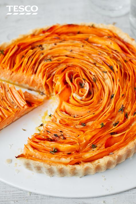 For a striking savoury bake, try this sweet potato, thyme and Parmesan flower tart. Swirl ribbons of sweet potato in rings around the pastry base for a pretty weekend lunch. | Tesco Good Sweet Potato Recipe, Potato Tart, Savoury Tarts, Thyme Recipes, Savoury Pies, Tesco Real Food, Onion Salad, Savory Tart, British Baking