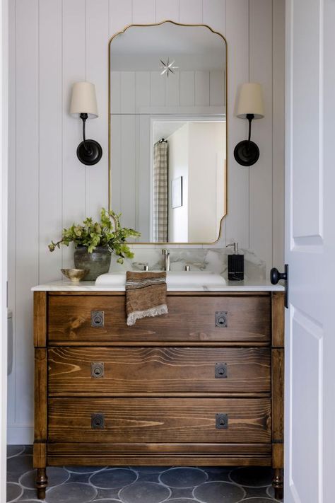 HGTV loves this bathroom with white wood wall paneling. Antique Cottage Bathroom, Antique Dresser Bathroom Vanity, Hgtv Bathrooms, Panelling Bathroom, Transitional Bathroom Ideas, Modern Transitional Farmhouse, French Cottage Bathroom, Dresser Vanity Bathroom, Wood Wall Paneling