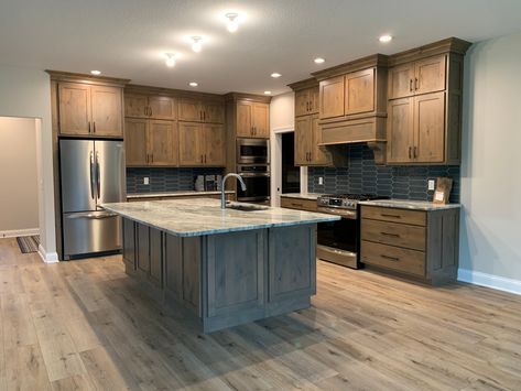 Hickory And Grey Kitchen, Shiplap Kitchen Island With Oak Cabinets, Box Cabinets Kitchen, Knotty Alder Cabinets With Wood Floors, Stained Cabinets With Painted Island, Brown Kitchen Cabinets Color Schemes, Stained Hickory Cabinets, Knotty Alder Kitchen Cabinets, Alder Wood Kitchen Cabinets