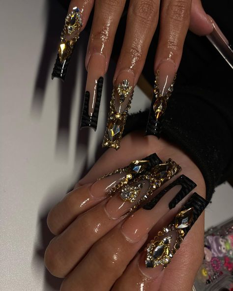 Black and gold always hits😩🖤✨ . . . Dm to book!💖 @nailed.byjennie #longnails #blacknails #goldnails #blingnails #frecnhnails #crocprintnails #nailsofinstagram #fresnonails #fresnonailtech #explorepage Black And Golden Nails Acrylic, Gold And Black Prom, Nail Designs Black And Gold, Black And Gold Nail Ideas, Gold Long Nails, Nails Black And Gold, Gold And Black Nails Acrylics, Black And Gold Birthday Nails, Black Freestyle Nails