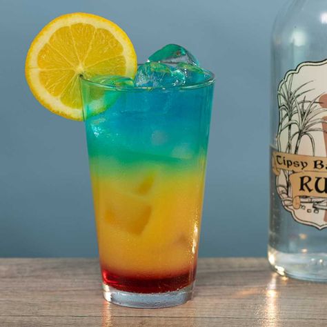 This here is the Barbados Surprise, and if there's anything shocking about this Caribbean-themed drink it's how crazy beautiful it is. Tipsy Bartender Jungle Juice, Tipsy Bartender Recipes, Grenadine Cocktail, Tropical Cocktail Recipes, Bartender Recipes, Frozen Drinks Alcohol, Rum Drinks Recipes, Alcoholic Punch Recipes, Summer Drinks Alcohol