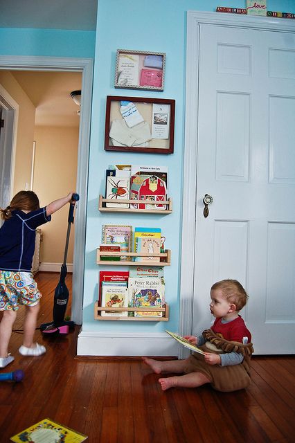 Quick and Easy Children’s Book Storage « Want to make the spice rack bookshelves to mount by bunk beds for book, light, extra lovies, etc.  will someone go to Ikea for me? Lol Ikea Spice Racks As Book Shelves, Spice Rack Bookshelves, Ikea Bekvam, Ikea Spice Rack, Kids Book Storage, Ideas Habitaciones, Ikea Bookshelves, Messy Kids, Spice Racks