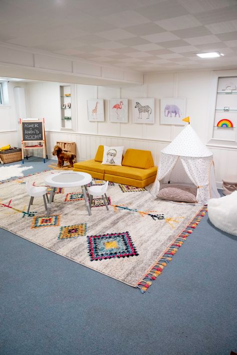 Basement Playroom Makeover On A Budget - The New York Stylist Finished Basement Playroom, Boho Basement, Basement Play Area, Kids Playroom Basement, Kids Playroom Ideas Basement, Cheap Vinyl Flooring, Family Room Playroom, Ceiling Basement, Playroom Makeover