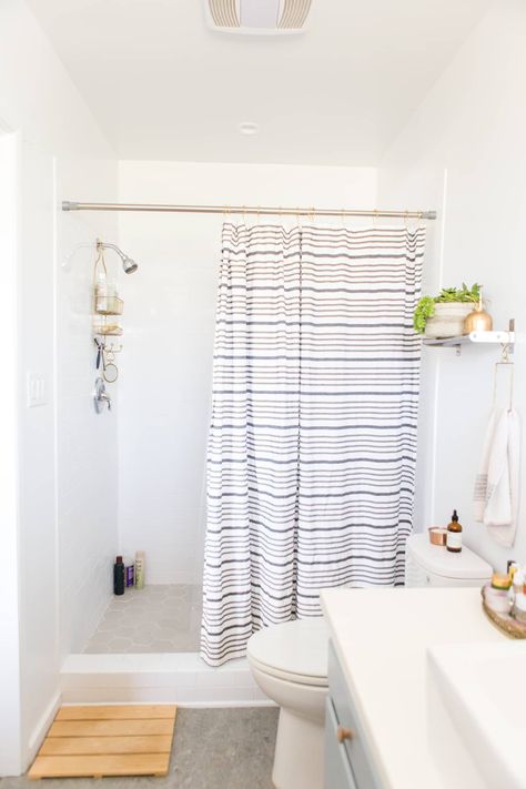 Small Details To Boost Your Rental Bathroom | Apartment Therapy Shower Remodel With Curtain, Shower With Curtain Instead Of Door, Bathroom Remodel No Tub, Bathrooms With Shower Curtains, Master Washroom, Cheap Remodel, Bathroom Setup, Rental Bathroom, House Upgrades