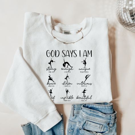 Ballet Dance Bible Verse Sweatshirt, Custom Dance Apparel, Christian Dance Shirt, Dance for Jesus, Christian Sweatshirt, Gift for Dancer, God Says I Am Strong, Unique, Enough, Brave, Chosen, Victorious, Loved, Capable, Beautiful The Gildan 18000 sweatshirt is made from a heavy blend of cotton and polyester, making it perfect for any situation. The ribbed knit collar will keep your neck warm, and the garment is machine-washable, so you can be sure it will look fresh and beautiful even after repeated washes.  CARE INSTRUCTIONS: Turn the sweatshirt or hoodie inside out. Machine wash cold with mild detergent. Tumble dry very low. Do not use bleach. Do not iron directly on design. OTHER IMPORTANT INFO ---------------------------------------------------------------------------------------------- Gymnastics Sweatshirts, Dance Shirts Ideas, Dance Hoodies, Dance Apparel, Dance Shirt, Gymnastics Gifts, Dance Shirts, God Says, Dance Recital