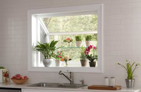 Add a touch of the outdoors to your kitchen or laundry room with a garden window replacement. These windows offer a sunny space for your favorite plants to grow. Kitchen Greenhouse Window Over Sink, Kitchen Bay Window Over Sink, Kitchen Garden Window Ideas, Sink With Backsplash, Kitchen Greenhouse, Kitchen Window Shelves, Kitchen Garden Window, Greenhouse Kitchen, Greenhouse Window