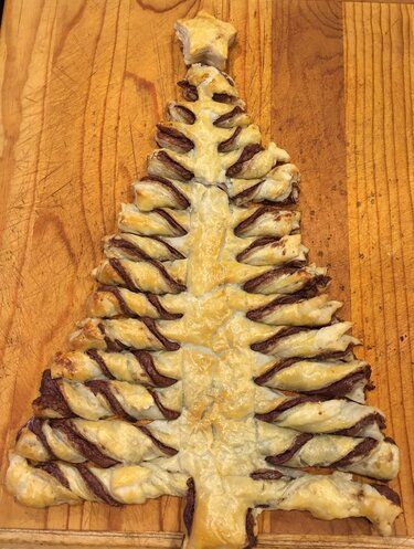 Nutella® Pastry Christmas Tree Recipe | Allrecipes Nutella Christmas Tree Puff Pastry Video, Christmas Tree Nutella, Tree Puff Pastry, Christmas Tree Pastry, Christmas Tree Puff Pastry, Christmas Tree Appetizers, Nutella Christmas Tree, Pastry Christmas Tree, Nutella Christmas