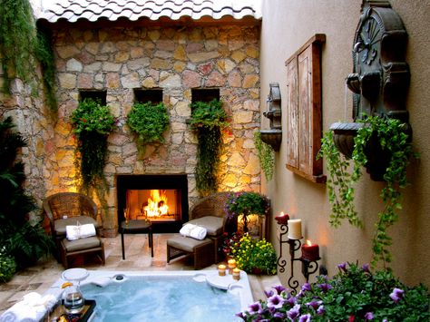 open air courtyard with hot tub in center and fireplace. #glgreen Home With Inner Courtyard, Courtyard With Jacuzzi, Spa Courtyard Ideas, Courtyard With Hot Tub, Master Suite Courtyard, Hot Tub Courtyard, Hot Tub With Fireplace, Mediterranean Hot Tub, Spanish Style Hot Tub