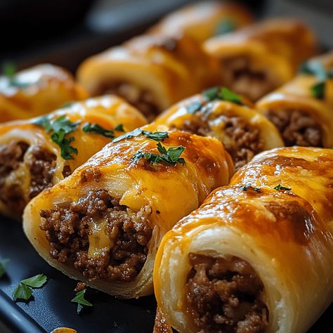 Cheesy Beefy Rolls-Up feature seasoned ground beef, melted cheese, and soft tortillas, creating a delicious and satisfying snack. Cheesy Ground Beef Delight Wrap, Ground Beef Rolled Tacos, Cheesy Beefy Rolls, Beef Roll Ups With Cream Cheese, Ground Beef With Crescent Rolls, Ground Beef And Pillsbury Crescent Rolls, Ground Beef Croissant Recipe, Appetizer Recipes With Ground Beef, Ground Beef Crossiant