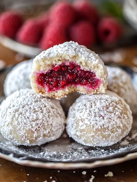 Christmas Snowballs Cookies, Raspberry Filled Snowballs, Raspberry Almond Filled Snowball Cookies, Raspberry Filled Almond Snowball, Raspberry Balls Recipe, Raspberry Filled Snowball Cookies, Raspberry Filled Almond Snow Cookies, Raspberry Snowball Cookies, Raspberry Christmas Cookies