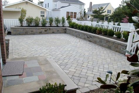 Be ready for next year's outdoor entertaining with a great patio made with CST Pavers Roman Cobble Antique Texture pavers and a sitting wall made with VERSA-LOK Retaining Wall Systems Mosaic Standard. This great job was done by our friends at Cashman Landscape Management & Design Inc.. Patio With Short Retaining Wall, Patio With Retaining Wall, Retaining Wall Patio, Small Retaining Wall, Sitting Wall, Management Design, Driveway Design, Backyard Inspiration, Retaining Walls