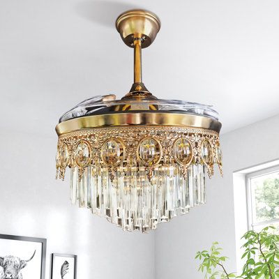 This fan was inspired by European royal palaces and incorporates vintage medieval Baroque relief style, it's a fantastic combination of functional ceiling fan and crystal chandelier! All the metal parts are covered by A-grade champagne-gold plating, and the metal frame was hand-made Baroque relief and egg-shaped crystal balls, 4-layer crystal bars are hanging on the bottom, making it absolutely stunning with lights turned on! It definitely will be a showstopper and make your room full of vintage Kitchen Lights With Fan, Gold Art Deco Chandelier, Victorian Ceiling Fan, Light Medallion Ceiling, French Ceiling Fan, Ceiling Fans With Chandelier Light, Small Chandelier Dining, Chandelier Fans Ceiling, Pretty Ceiling Fan