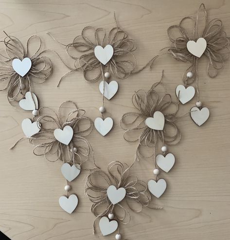 "Materials- Wood hearts, Jute, wood beads, glue.  Measurements- 8 1/2\" long and 5\" wide. Description- The listing includes 6 rustic Christmas Tree Ornaments. Done in all natural materials. They are designed front and back in case they twirl. There is a heart center of a swirl flower jute bow. Two dangling hearts on beaded jute.  Decorating Ideas- Add a little Rustic Romance to your main tree or a pencil tree and Hang them from garland, You are only limited by your imagination. Have fun decorating Shipping Policies- During check out please make sure your address is correct. I attempt to get your order mailed out as soon as possible, unfortunately, at times there are slight delays, I will message you to let you know if there will be a delay. Returns- Returns are free, with no hassles. Plea Natural Christmas Ornaments, Twine Flowers, Jute Flowers, Tree Bows, Pencil Trees, Rustic Valentine, Valentine Tree, Ornaments Homemade, Christmas Tree Bows