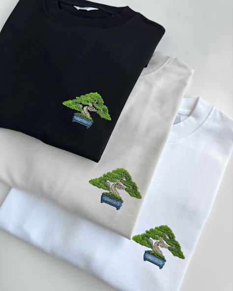 Wearable art BONSAI🌳 This embroidery design features a detailed mini bonsai tree, perfect for the left chest or center placement. Available in 16 colors for hoodies, sweatshirts, and t-shirts, so you can find your favorite one. Our premium clothing is made from thick, 100% organic cotton, ensuring durability and a sustainable choice. Mini Bonsai, Bonsai Tree, Wearable Art, Embroidery Design, Design Features, Embroidery Designs, Organic Cotton, Finding Yourself, Embroidery