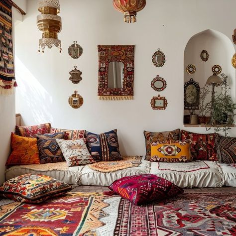 Bohemian-inspired living room with vibrant colors, textured rugs, eclectic cushions, ornate mirrors, and cultural tapestries, creating a cozy and welcoming space for relaxation and socializing. Turkish Living Room, Turkish Decor, Vibrant Living Room, Colorful Tapestry, Ornate Mirror, Traditional Living, Bohemian Living Room, Cozy Nook, Rich Textures