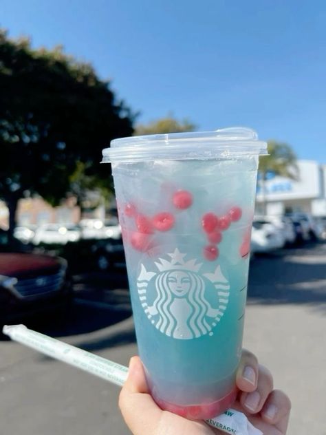 Calling all Starbucks lovers! 😍 Imagine sipping on the most refreshing, vibrant, and downright delicious drink that captures the essence of summer skies. 🌞🪽 This beauty from Starbucks is the perfect blend of fruity flavors and cool iced goodness. It's like holding a piece of the sky in your hands! 🌤️✨ Whether you need a pick-me-up or just want to treat yourself, this is THE drink of the season. Get ready to fall in love with every sip! #StarbucksSummer #DrinkTheSkies #FruityDelight #IcedPerfection #StarbucksObsessed Passion Fruit Mojito, Aesthetic Starbucks, Summer Skies, Starbucks Rewards, Starbucks Lovers, Menu Sign, Starbucks Drink, Fancy Video, Summer Sky