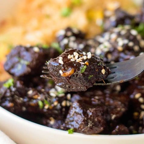 These Slow Cooker Honey Garlic Steak Bites are tender and juicy and loaded with Asian flavors. Requiring just a handful of simple ingredients and about 15 minutes of prep time, this is an easy, hearty and delicious meal the whole family will love. Slow Cooker Garlic Butter Beef Bites, Garlic Butter Beef Bites And Potatoes Crockpot, Slow Cooker Garlic Butter Beef Bites And Potatoes, Crock Pot Garlic Butter Steak Bites And Potatoes, Slow Cooker Honey Garlic Steak Bites, Asian Steak Bites, Garlic Steak, Crockpot Steak, Steak Bites Recipe