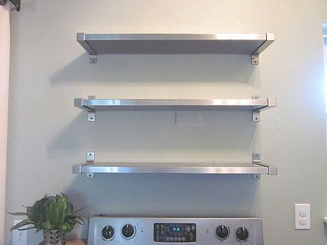 Stainless steel shelving from IKEA Ikea Kitchen Shelves, Dapur Ikea, Wall Mounted Kitchen Shelves, Kitchen Appliances Organization, Stainless Steel Kitchen Shelves, Stainless Steel Shelving, Wall Stove, White Wall Paint, Kitchen Wall Shelves