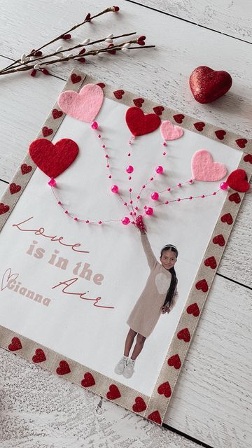 Kiara Sierra on Instagram: "Love is in the air 💕🎈 . Handcrafting Cupid-Approved Valentine’s Bliss 💘 So in LOVE with how cute these turned out 😍 . . How to: 1. Take a picture of your little cutie with their arm in air. 2. Hold down on picture and press copy. 3. Open pages app and paste in your photo. *Edit* 4.Visit everything-always.com to download your free template! 5. Add this photo into your pages document and size 6. Print and decorate 💕💘 . Ribbon & Felt hearts stickers found at @dollartree 👏🏼 . #valentinesday #valentines #mylittlevalentine #keepsake #vdaycrafts #valentinesdaycrafts #ideasforkids #kidscrafts #dollarstorecrafts #diy #montessori #preschool #playandlearn #playathome #sensoryplay #learningthroughplay #preschoolactivity #montessorikids #playbasedlearning #montessori Love Is In The Air Craft For Kids, Love Is In The Air Preschool Craft, Valentine's Day Keepsake Necklace With Heart Beads, Valentine's Day Heart Beads Necklace Keepsake, Valentines Sun Catcher Craft, Valentine Sun Catchers For Kids, Valentine’s Day Picture Frame Craft, Vday Crafts, Playbased Learning