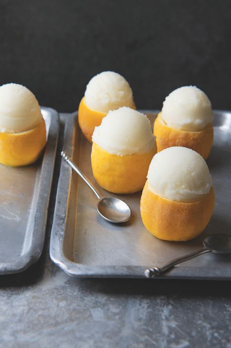 Lemon sorbet in shells | Food and Travel Magazine Sorbet In Lemon, Lemon Sorbet, Travel Magazine, Brioche Buns, Food And Travel, The Flesh, Lemon Desserts, Lemon Recipes, Ice Cream Maker