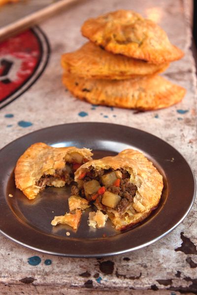 A hit of curry and cayenne elevates these Nigerian Meat Pies to something rich and comforting. Nigerian Meat Pie, Cornish Pasty, Nigeria Food, Meat Pie Recipe, African Spices, West African Food, Nigerian Recipes, Meat Pies, Foreign Food