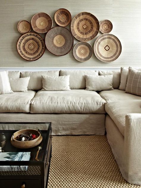 12 Ways to Decorate Above Your Sofa | One Thing Three Ways | HGTV Plates On The Wall, Basket Walls, Decoration Hall, Basket Wall Decor, Inspire Me Home Decor, African Decor, Family Room Design, Boho Living, Inspired Living