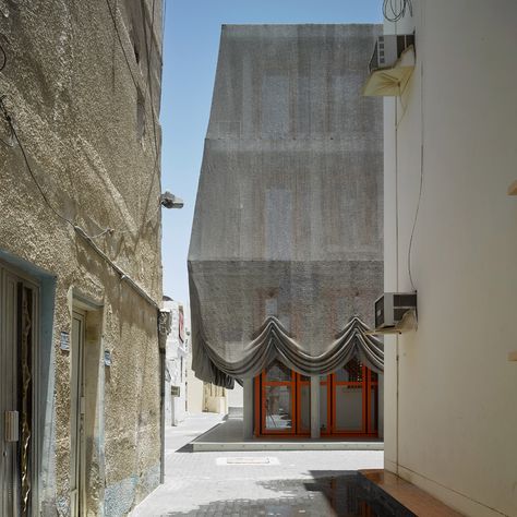 Office Kersten Geers David Van Severen drapes Bahrain music centre with mesh curtains Concrete Column, Wooden Shutters, Traditional Music, Glass Facades, Music Centers, Cultural Center, Facade Architecture, Steel Mesh, Metal Buildings