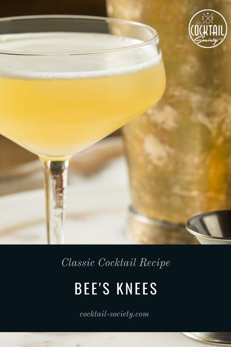 The Bee's Knees is a Gin cocktail sweetened with honey syrup. A cocktail that's close to a classic Gin Sour but still rightfully has its own entry in the list of IBA cocktails. #Beesknees #gin #honey #honeycocktail #cocktailrecipe #cocktailhistory #honeysyrup #honeycocktail Lemon Peel Garnish, Bees Knees Cocktail, Honey Cocktail, Gin Sour, Classic Cocktail Recipes, Gin Cocktail, Bee's Knees, Honey Syrup, Classic Cocktail