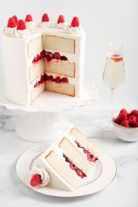 The sophisticated Raspberry Champagne Cake is the perfect way to toast any celebration! Three layers of our fluffy vanilla cake are soaked in French Champagne. Each layer is filled with fresh raspberries, homemade raspberry preserves, and blanketed in our French Champagne vanilla bean buttercream. All topped with fresh Raspberry Champagne, Fluffy Vanilla Cake, Vanilla Bean Buttercream, Champagne Cake, Raspberry Preserves, Slow Cooker Desserts, Fresh Raspberries, Eat Dessert First, No Bake Treats