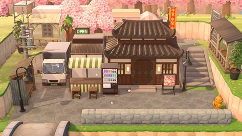 Acnh Japanese Building, Acnh Bathhouse, Acnh Japanese Shopping District, Acnh Japanese Street, Acnh Ramen Shop, Acnh House Exterior Ideas, Japanese City Core Acnh, Animal Crossing Ramen Shop, Animal Crossing Japanese Town