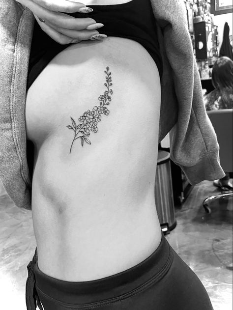 Larkspur Collar Bone Tattoo, Lark Spur Flower Tattoo, Larkspur Rib Tattoo, Larkspur Tattoo Design, Larkspur And Water Lily Tattoo, Larkspur Flower Tattoo, Larkspur Flower Tattoos, Side Body Tattoos, Larkspur Tattoo