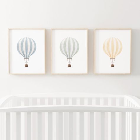 Elevate your nursery decor with these charming Vintage Watercolor Hot Air Balloon wall art sets. Perfect for creating a whimsical and dreamy atmosphere for your little one's room. Each piece is carefully crafted in soft watercolors, capturing the essence of childhood adventure. Add a touch of nostalgia and creativity to your nursery with these unique art pieces. #nurserydecor #wallart #vintagedecor #hotairballoon #watercolorart #kidsroom #dreamydecor #adventure #childhoodmemories #whimsicalart Vintage Posters Pink, Hot Air Balloon Nursery Theme, Hot Air Balloon Nursery Art, Balloon Nursery Decor, Hot Air Balloon Nursery Decor, Watercolor Hot Air Balloon, Hot Air Balloons Art, Air Balloon Nursery, Balloon Nursery