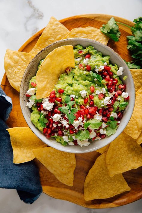 Homemade pomegranate guacamole makes a beautiful holiday appetizer! This festive recipe is a gluten-free snack that everyone will enjoy. Pomegranate Snacks, Pomegranate Guacamole, Avocado Burrito, Pomegranate Recipes, Dips Recipes, Guacamole Dip, Black Bean Tacos, Bean Tacos, Holiday Appetizer