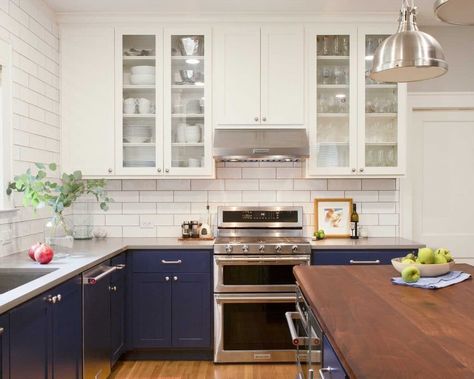 We love this two-toned kitchen!  We painted the upper cabinets in Sherwin Williams "Pure White" and the lower cabinets in "Anchors Aweigh". Blue And White Kitchen Cabinets, Two Tone Kitchen Cabinets, Two Tone Cabinets, Light Wood Cabinets, Anchors Aweigh, Two Tone Kitchen, Flat Panel Cabinets, White Backsplash, Kitchen Stand