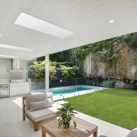 The perfect outdoor entertaining space in Mosman: lush green grass, outdoor kitchen and seating area, tropical landscaping and, of course, a Blue Haven Pool.

📸  by Mert Property Images Outdoor Entertaining Area Pool, Pool Entertainment Area, Modern Queenslander, Garden Pool Design, Outdoor Entertainment Area, Blue Haven Pools, Green Backyard, Living Pool, Open House Plans