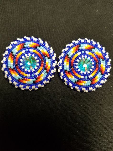 10mm Swarovski crystals surrounded by a blend of blues and fire color swirls Beaded Jewelry Native, Cab Earrings, Beadwork Ideas, Native American Beadwork Patterns, Beautiful Beaded Earring, Native Beading, Earring Inspo, Beaded Work, Fire Color